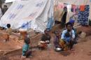 This picture taken on March 6, 2014 shows a family of Christian Internally Displaced People at a refugee camp in the yard of the Bossangoa Catholic Church