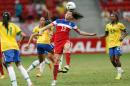 United States' Lauren Holiday, center, (12) heads the ball during a final match of the International Women's Football Tournament at the National Stadium in Brasilia, Brazil, Sunday, Dec. 21, 2014. (AP Photo/Eraldo Peres)