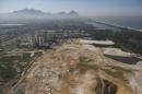 FILE - This June 27, 2014 file photo, shows an aerial view of the Rio 2016 Olympic golf course under construction in Rio de Janeiro, Brazil. Rio de Janeiro's Olympic golf course faces an uncertain future after a court proposed Wednesday Sept. 3 2014, that the under-construction layout should be modified to meet environmental concerns. Judge Eduardo Klausner, hearing a lawsuit brought against the city of Rio de Janeiro and the course developer, said the defendants had to return on Sept. 17 to say if they could accept the proposal. Klausner said work on the course could continue, but no new areas of vegetation could be plowed under. (AP Photo/Leo Correa, File)