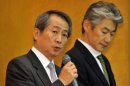 Kenichi Watanabe (left) speaks as Nomura Securities president Koji Nagai listens during a press briefing in Tokyo