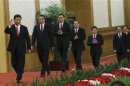 China's new Politburo Standing Committee members Xi Jinping, Li Keqiang, Zhang Dejiang, Yu Zhengsheng, Liu Yunshan, Wang Qishan and Zhang Gaoli, arrive to meet with the press at the Great Hall of the People in Beijing