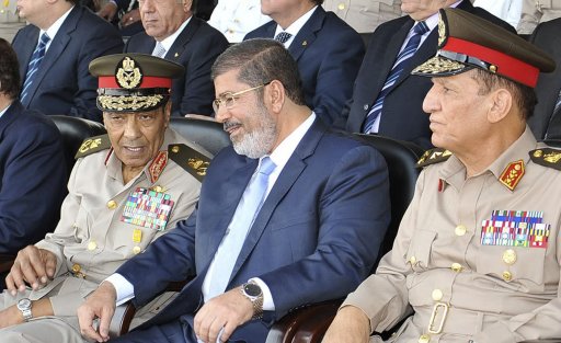 File photo of Egypt's new Islamist President Mohamed Mursi speaking with Field Marshal Hussein Tantawi and Egyptian Armed Forces Chief Of Staff Sami Anan in Cairo