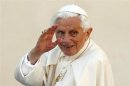 Pope Benedict XVI waves as he arrives to lead the Wednesday general audience in Saint Peter's square at the Vatican