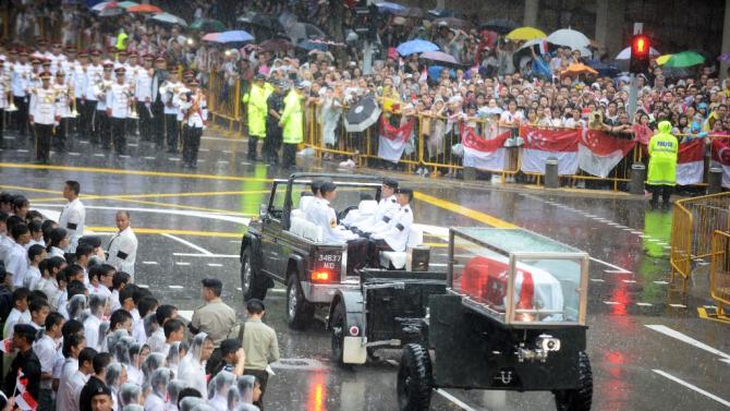 The body of former prime minister Lee Kuan Yew is transferred atop a gun carriage during a funeral procession in Singapore on March 29, 2015