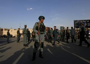 Afghan policemen stand guard at the site of a blast &hellip;