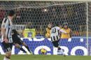 Udinese forward Antonio Di Natale shoot and scores during the Italian Serie A soccer match between Bologna and Udinese at Renato Dall' Ara stadium in Bologna, Italy, Saturday, Feb. 1, 2014. (AP Photo/Studio FN)