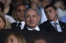 Israel's PM Netanyahu smiles during the opening ceremony of the Maccabiah Games in Jerusalem