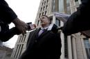 Paul J. D'Agrosa, attorney for Sedina Hodzic, speaks outside federal court following a hearing Wednesday, Feb. 11, 2015, in St. Louis. Sedina Hodzic and her husband Ramiz Hodzic have pleaded not guilty to federal charges of funneling money and military supplies to extremist groups in Iraq and Syria. (AP Photo/Jeff Roberson)