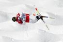 Canada's Alex Bilodeau jumps during freestyle skiing moguls training at the Rosa Khutor Extreme Park ahead of the 2014 Winter Olympics, Friday, Feb. 7, 2014, in Krasnaya Polyana, Russia. (AP Photo/Andy Wong)