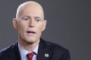 Florida Governor Scott speaks during an interview in New York