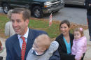 FILE - In this Tuesday, Nov. 7, 2006 file photo, Delaware Attorney General candidate Beau Biden, holds his son, Hunter, as he walks with his wife, Hallie, holding their daughter, Natalie, as they enter a polling place to cast their votes in Wilmington, Del. On Saturday, May 30, 2015, Vice President Joe Biden announced the death of son, Beau, from brain cancer. (AP Photo/Pat Crowe II)