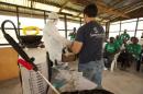 A Samaritan's Purse medical personnel demonstrates personal protective equipment to educate volunteers on the Ebola virus in Liberia, in this undated handout photo