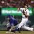 Texas Rangers' Ian Kinsler, left, is out at second as St. Louis Cardinals shortstop Pete Kozma fails to turn the double play during the fourth inning of a baseball game on Friday, June 21, 2013, in St. Louis. Rangers' Elvis Andrus was safe at first. (AP Photo/Jeff Roberson)