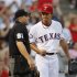 Rangers' Darvish talks with home plate umpire Knight in the second inning of MLB American League baseball game against Rays in Arlington