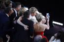 Host Degeneres takes a group picture at the 86th Academy Awards in Hollywood