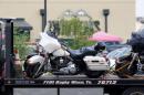 A motorcycle is seen on a wrecker before it is removed from the Twin Peaks restaurant, where nine members of a motorcycle gang were shot and killed, in Waco