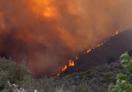 The Gladiator Fire burns in the Bradshaw Mountains in Prescott National Forest, Ariz. on Wednesday, May 16, 2012. Authorities are worried that flames from the Gladiator Fire will get past a fire line that's about a mile west of the historic mining town of Crown King, fire incident spokeswoman Loretta Benavidez said Tuesday night. (AP Photo/The Arizona Republic, David Wallace) MARICOPA COUNTY OUT; MAGS OUT; NO SALES