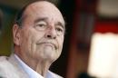 A file picture taken on August 14, 2011 shows France's former president Jacques Chirac sitting in a café in the French Riviera sea resort of Saint-Tropez