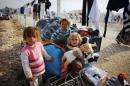 Kurdish refugee girls from Kobani play in a refugee camp in Suruc