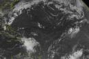 This NOAA satellite image taken Friday, Aug. 28, 2015 at 9:45 AM EDT shows a poorly organized Tropical Storm Erika located just to the Southwest of Puerto Rico. Erika currently has winds of 50 miles an hour and is producing heavy rainfall over Hispaniola and the surrounding islands in the Eastern Caribbean. Erika will continue moving to the west-northwest over Hispaniola. Fair weather can be expected across the rest of the Caribbean with only typical summertime showers and thunderstorms. (Weather Underground via AP)