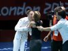 Italy's Di Francisca is kissed by an unidentified woman as she celebrates defeating her compatriot Errigo during their women's Individual Foil gold medal fencing match at the ExCel venue at the London 2012 Olympic Games