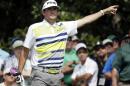 Bubba Watson points to his tee shot on the ninth hole during the second round of the Masters golf tournament Friday, April 11, 2014, in Augusta, Ga. (AP Photo/Darron Cummings)