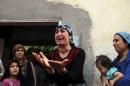 Turkish Kurdish woman reacts as she talks to visiting journalists in the southeastern town of Cizre in Sirnak province, Turkey