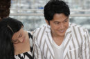From left, actors Machiko Ono, Masaharu Fukuyama and Keita Ninomiya pose for photographers during a photo call for the film Like Father, Like Son at the 66th international film festival, in Cannes, southern France, Saturday, May 18, 2013. (AP Photo/Lionel Cironneau)