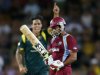 West Indies' Sarwan reacts as Australia's Johnson celebrates bowling him out during their one-day international cricket match at Manuka Oval in Canberra