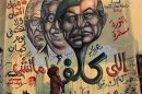 A girl walks past a mural depicting a combination of the faces of Egypt's former president Hosni Mubarak and Field Marshal Mohamed Hussein Tantawi in Cairo