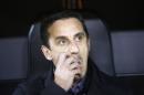 FILE - In this Wednesday Feb. 10, 2016 file photo, Valencia's head coach Gary Neville gestures prior to a semifinal, second leg, Copa del Rey soccer match between Valencia and Barcelona, at the Mestalla stadium in Valencia, Spain. Spanish club Valencia has fired coach Gary Neville less than four months after hiring the former England defender. The club said Wednesday, March 30, 2016 in a statement on its website that it 