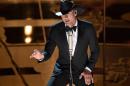 FILE - In this Feb. 22, 2015 file photo, Tim McGraw performs at the Oscars at the Dolby Theatre in Los Angeles. McGraw will hold a concert for Sandy Hook this summer and dedicate all of the proceeds to an organization aimed at protecting children from gun violence. He will perform at the XFINITY Theatre in Hartford, Connecticut, on July 17. (Photo by John Shearer/Invision/AP, File)