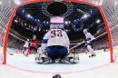 Canada's forward Jordan Eberle (2nd L) shoots to score past goalkeeper Ronan Quemener of France during the group A preliminary round match at the 2015 IIHF Ice Hockey World Championships on May 9, 2015 at the O2 Arena in Prague