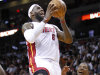 Miami Heat forward LeBron James (6) goes up for a shot against Brooklyn Nets guard Joe Johnson (7) during the first half of an NBA basketball game, Wednesday, Nov. 7, 2012, in Miami. (AP Photo/Wilfredo Lee)