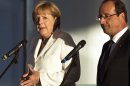 Germany's Chancellor Angela Merkel, left, and France’s President Francois Hollande brief the media prior to a meeting at the chancellery in Berlin, Thursday, Aug. 23, 2012 .The leaders of Germany and France are stressing that it's up to Greece to keep pursuing painful reforms as it strives to keep its place in the euro. Chancellor Angela Merkel and President Francois Hollande were meeting Thursday before both hold talks over the next two days with Greece's new prime minister, Antonis Samaras. (AP Photo/Markus Schreiber)