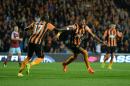 Hull City's Abel Hernandez, right, celebrates with teammate Mohamed Diame after scoring against West Ham United during the English Premier League soccer match at the KC Stadium, Hull, England, Monday Sept. 15, 2014. (AP Photo/PA, Anna Gowthorpe) UNITED KINGDOM OUT NO SALES NO ARCHIVE