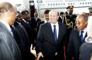 Exiled Yemeni President Abedrabbo Mansour Hadi is welcomed by officials upon his arrival at the airport on August 29, 2015 in Khartoum, Sudan