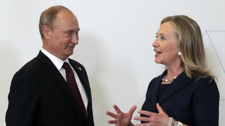 Russian President Vladimir Putin (L) listens to former US Secretary of State Hillary Clinton during the Asia-Pacific Economic Cooperation Summit in Vladivostok, Russia on September 8, 2012