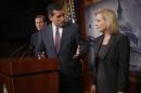 Sen. Ted Cruz, R-Texas, center, talks with Sen. Kirsten Gillibrand, D-N.Y. on Capitol Hill in Washington, Thursday, March 6, 2014, during a news conference following a Senate vote on military sexual assaults. The Senate blocked a bill that would have stripped senior military commanders of their authority to prosecute rapes and other serious offenses, capping an emotional, nearly yearlong fight over how best to curb sexual assault in the ranks. Sen. Richard Blumenthal, D-Conn. is at left. (AP Photo/Charles Dharapak)