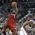 Miami Heat forward LeBron James (6) shoots over Boston Celtics guard Rajon Rondo, right, during the first half in Game 6 of the NBA basketball Eastern Conference finals, Thursday, June 7, 2012, in Boston. (AP Photo/The Miami Herald, Charles Trainor Jr.)  MAGS OUT