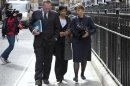Marina Litvinenko leaves a hearing into the death of her husband, Alexander Litvinenko, in London
