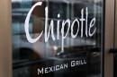 FILE - This Tuesday, Jan. 28, 2014, file photo, shows the door at a Chipotle Mexican Grill in Robinson Township, Pa. On Tuesday, April 29, 2014, Chioptle Chief Financial Officer Jack Hartung noted that the chain doesn't currently charge a whole lot more for its steak filling, even though beef costs have climbed considerably. He says Chipotle will widen the price gap between steak and chicken. (AP Photo/Gene J. Puskar, File)