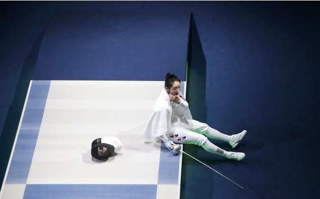 South Korea's Shin reacts after being defeated by Germany's Heidemann during their women's epee individual semifinal fencing competition at the ExCel venue at the London 2012 Olympic Games