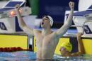 Daniel Wallace of Scotland celebrates winning gold in the Men's 400m Individual Medley final at the Tollcross International Swimming Centre during the Commonwealth Games 2014 in Glasgow, Scotland, Friday July 25, 2014. (AP Photo/Kirsty Wigglesworth)