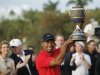 Woods hoists the Gene Sarazen Trophy after winning the 2013 WGC-Cadillac Championship PGA golf tournament in Doral