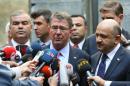 US Secretary of Defence Ashton Carter addresses journalists after a visit of the Grand National Assembly of Turkey (TBMM) and a meeting with Turkish Defence Minister Fikri Isik (R) in Ankara