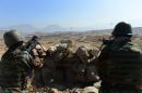 Afghan National Army soldiers look on from their positions during a combat training exercise in Kabul on October 22, 2014