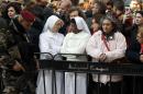 People take part in the Christmas Eve celebrations on December 24, 2016 outside the Church of the Nativity, revered as the site of Jesus Christ's birth, in the biblical West Bank town of Bethlehem