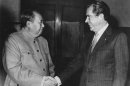 FILE - In this Feb. 21, 1972, file photo, Chinese communist party leader Mao Tse-Tung, left, and U.S. President Richard Nixon shake hands as they meet in Beijing. Nixon's visit marked the first time an American president visited China. (AP Photo/File)