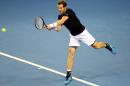 Britain's Andy Murray plays a return to Australia's Thanasi Kokkinakis during their Davis Cup semifinal tennis singles match in Glasgow, Scotland Friday Sept. 18, 2015. (AP Photo/Scott Heppell)